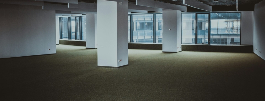 An empty office space in a large building.