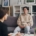 A young person sitting on a couch in a therapist office, with their therapist sitting across from them.