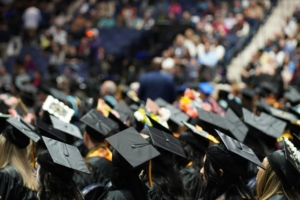 A group of people wearing graduation caps at a graduation ceremony.