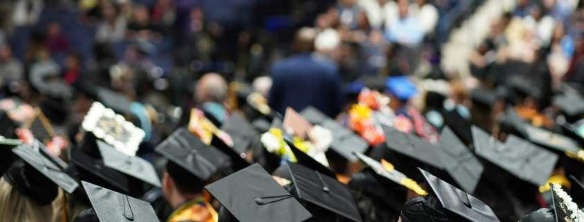 A group of people wearing graduation caps at a graduation ceremony.